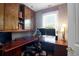 Functional home office with wood desk, built-in cabinets, and dual monitors at 118 E Ashley And 110 E Cooper Ave Ave, Folly Beach, SC 29439