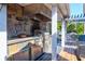 Outdoor kitchen with stainless steel appliances and stone at 118 E Ashley And 110 E Cooper Ave Ave, Folly Beach, SC 29439