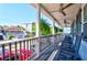 Relaxing front porch with rocking chairs and street view at 118 E Ashley And 110 E Cooper Ave Ave, Folly Beach, SC 29439