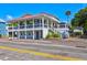 Two-story home with a wrap-around porch and fenced backyard at 118 E Ashley And 110 E Cooper Ave Ave, Folly Beach, SC 29439