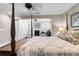 Main bedroom with a four poster bed, built-in wardrobe, and hardwood floors at 118 E Ashley And 110 E Cooper Ave Ave, Folly Beach, SC 29439