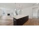 Open kitchen with large island and view into living room at 1647 Cultivation Ln # 451, Mount Pleasant, SC 29466