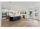 Modern kitchen with white cabinets, large island, and stainless steel appliances at 1647 Cultivation Ln # 451, Mount Pleasant, SC 29466