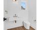 Small bathroom with floating vanity, white shiplap, and modern toilet at 2151 River Road, Johns Island, SC 29455