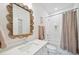 Clean bathroom with a unique mirror and tub at 420 Carolina Cherry Ct # 201, Charleston, SC 29414