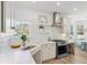 Modern white kitchen with stainless steel appliances and marble countertops at 420 Carolina Cherry Ct # 201, Charleston, SC 29414