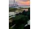 Scenic view of the Arthur Ravenel Jr. Bridge at sunset over marshland at 252 Cooper River Dr, Mount Pleasant, SC 29464