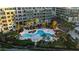 Community pool with ample lounge chairs surrounded by palm trees at 252 Cooper River Dr, Mount Pleasant, SC 29464