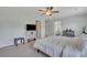 Bright bedroom with a queen bed, TV, and ample closet space at 432 Blue Elderberry, Moncks Corner, SC 29461