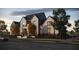Two-story home with gray exterior and metal roof at 141 Ithecaw Creek St, Charleston, SC 29492