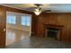 Sunroom with wood paneling, fireplace, and tile flooring at 208 Holly Rd, Walterboro, SC 29488