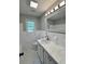 Updated bathroom features a white vanity, marble countertop, and tiled floors at 401 Constance St, Walterboro, SC 29488
