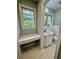 Updated bathroom with a white vanity and marble-look flooring at 401 Constance St, Walterboro, SC 29488