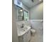Modern bathroom with white tile and marble-look vanity top at 401 Constance St, Walterboro, SC 29488