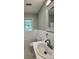 Updated bathroom features a white vanity, marble countertop, and tiled floors at 401 Constance St, Walterboro, SC 29488
