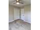 Spacious bedroom with carpet, ceiling fan, and new doors at 401 Constance St, Walterboro, SC 29488
