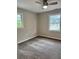 Bright bedroom with neutral walls, new carpet, and ceiling fan at 401 Constance St, Walterboro, SC 29488