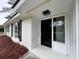 Inviting front entrance with a new black door and updated light fixture at 401 Constance St, Walterboro, SC 29488