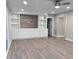 Spacious Gathering room with built-in shelving and wood-look flooring at 401 Constance St, Walterboro, SC 29488