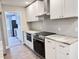 Modern kitchen with white cabinets, granite countertops, and stainless steel appliances at 401 Constance St, Walterboro, SC 29488