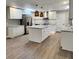 Remodeled kitchen with island, stainless steel appliances, and white shaker cabinets at 401 Constance St, Walterboro, SC 29488