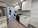 Modern kitchen with white cabinets, granite countertops, and stainless steel appliances at 401 Constance St, Walterboro, SC 29488