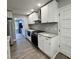 Modern kitchen with white cabinets, granite countertops, and stainless steel appliances at 401 Constance St, Walterboro, SC 29488