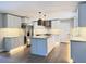 Spacious kitchen with white cabinets, granite counters, and large island at 401 Constance St, Walterboro, SC 29488