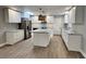 Remodeled kitchen with island, stainless steel appliances, and white shaker cabinets at 401 Constance St, Walterboro, SC 29488