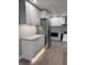Modern kitchen with white cabinets, granite countertops and under cabinet lighting at 401 Constance St, Walterboro, SC 29488