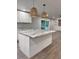 Kitchen island with granite countertop and stylish lighting at 401 Constance St, Walterboro, SC 29488