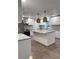 Modern kitchen with white cabinets, granite countertops, and stainless steel appliances at 401 Constance St, Walterboro, SC 29488