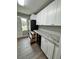 Updated kitchen with white cabinets, granite countertops, and stainless steel appliances at 401 Constance St, Walterboro, SC 29488