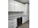 Updated kitchen with white cabinets and granite countertops at 401 Constance St, Walterboro, SC 29488