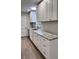 Modern kitchen with white cabinets, granite countertops, and stainless steel appliances at 401 Constance St, Walterboro, SC 29488