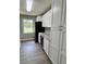 Updated kitchen with white cabinets, granite countertops, and stainless steel appliances at 401 Constance St, Walterboro, SC 29488