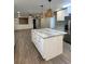 Remodeled kitchen with island, stainless steel appliances, and white shaker cabinets at 401 Constance St, Walterboro, SC 29488