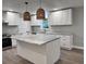 Modern kitchen with white cabinets, granite countertops and a large island at 401 Constance St, Walterboro, SC 29488