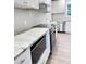 Modern kitchen with white cabinets, granite countertops, and stainless steel appliances at 401 Constance St, Walterboro, SC 29488