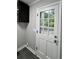 Laundry room with exterior access and black cabinets at 401 Constance St, Walterboro, SC 29488
