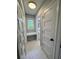Clean laundry room featuring ample storage and marble-look flooring at 401 Constance St, Walterboro, SC 29488