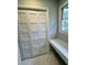 Well-lit laundry area with marble-look floors and storage at 401 Constance St, Walterboro, SC 29488