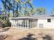 Spacious screened porch overlooks a wooded backyard at 401 Constance St, Walterboro, SC 29488