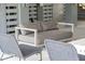 Comfortable gray cushioned sofa and wicker chairs on patio at 1698 Cultivation Ln # 541, Mount Pleasant, SC 29466