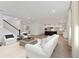 Open living room features hardwood floors and a view into the kitchen at 1698 Cultivation Ln # 541, Mount Pleasant, SC 29466