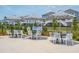 Outdoor seating area with tables and chairs near the pool at 1698 Cultivation Ln # 541, Mount Pleasant, SC 29466