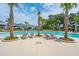 Community pool with lounge chairs and palms at 1698 Cultivation Ln # 541, Mount Pleasant, SC 29466