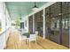 Screened community deck with tables and chairs at 1698 Cultivation Ln # 541, Mount Pleasant, SC 29466