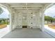 White gazebo with storage area and wooden planters at 1698 Cultivation Ln # 541, Mount Pleasant, SC 29466