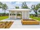 White gazebo with metal roof and wooden benches at 1698 Cultivation Ln # 541, Mount Pleasant, SC 29466
